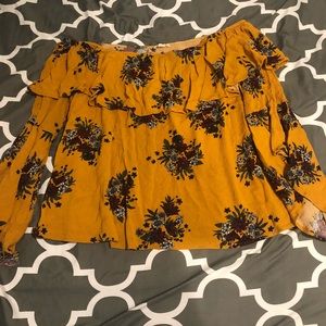 Floral off the should top.